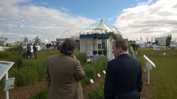 Farming Minister George Eustice talks to Professor Malcolm Hawksford, from Rothamsted Research at Cereals 2015