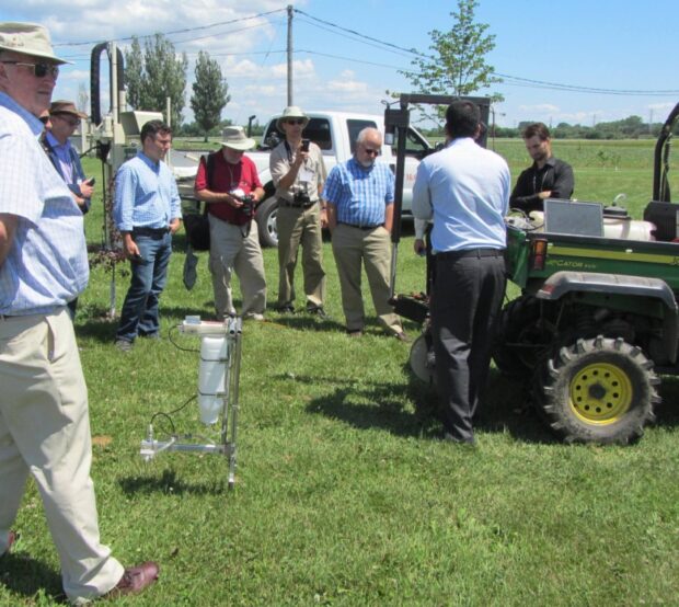 Paricipants of the 2014 UK-Canada workshop in precision agriculture observing automated equipment developed at McGill University.